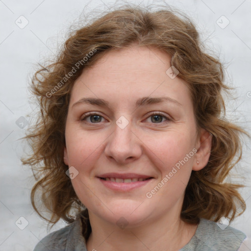 Joyful white young-adult female with medium  brown hair and blue eyes