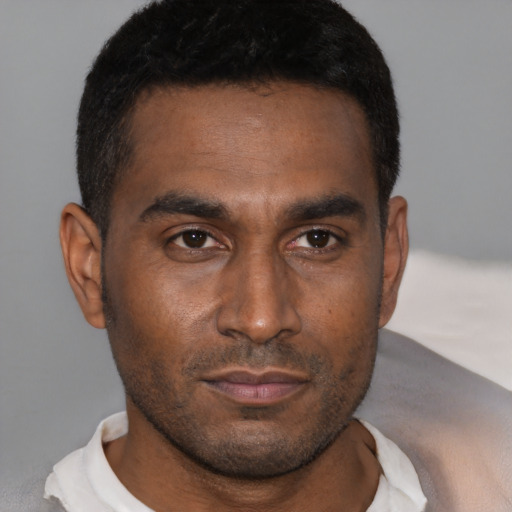 Neutral black young-adult male with short  brown hair and brown eyes