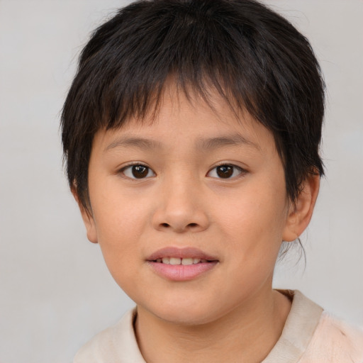 Joyful white child female with short  brown hair and brown eyes