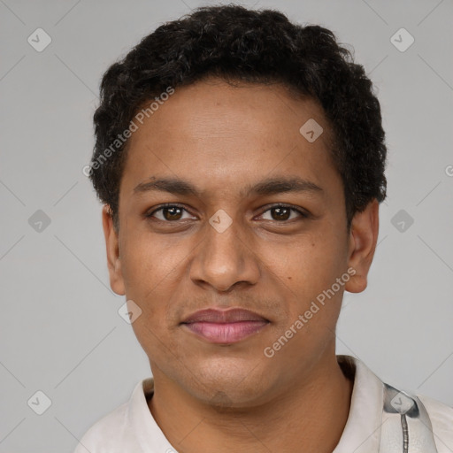 Joyful black young-adult male with short  black hair and brown eyes