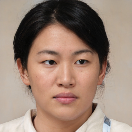 Neutral asian young-adult female with medium  brown hair and brown eyes
