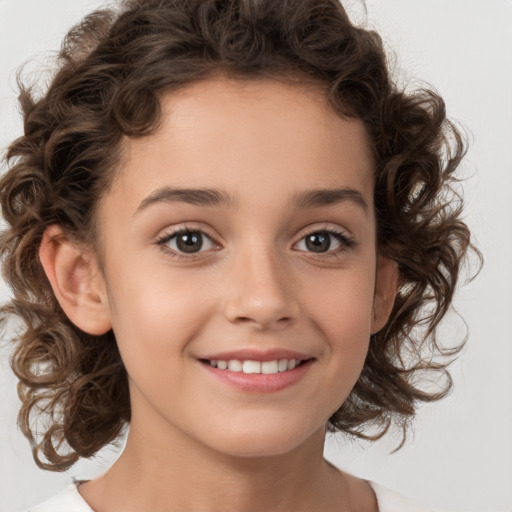 Joyful white child female with medium  brown hair and brown eyes