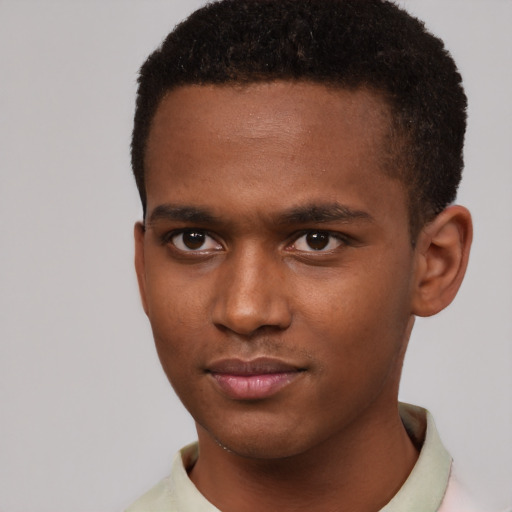 Joyful black young-adult male with short  brown hair and brown eyes