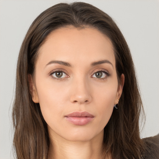 Neutral white young-adult female with long  brown hair and brown eyes