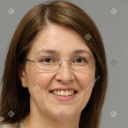 Joyful white adult female with medium  brown hair and grey eyes