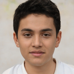 Joyful latino young-adult male with short  brown hair and brown eyes