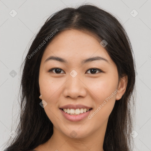 Joyful asian young-adult female with long  brown hair and brown eyes