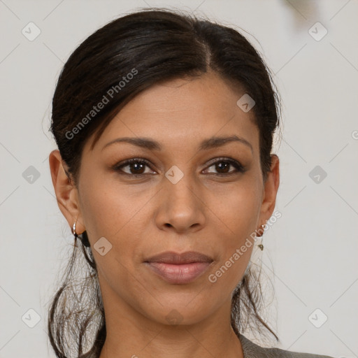 Joyful latino young-adult female with medium  brown hair and brown eyes