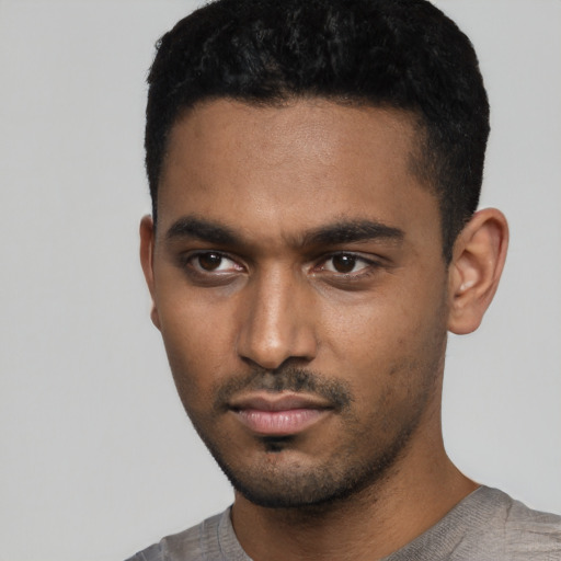 Neutral black young-adult male with short  black hair and brown eyes