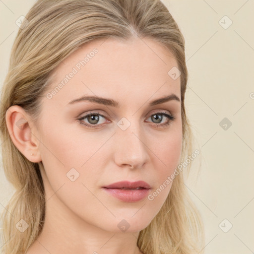 Joyful white young-adult female with long  brown hair and green eyes