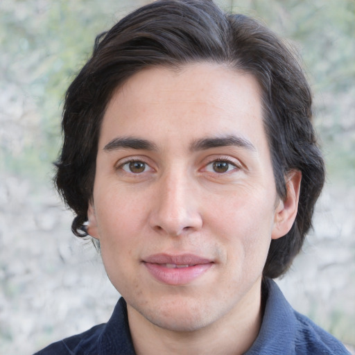 Joyful white young-adult male with medium  brown hair and brown eyes