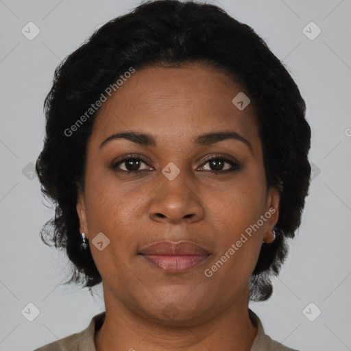 Joyful black adult female with short  brown hair and brown eyes