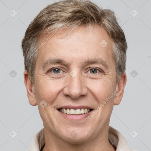 Joyful white adult male with short  brown hair and grey eyes