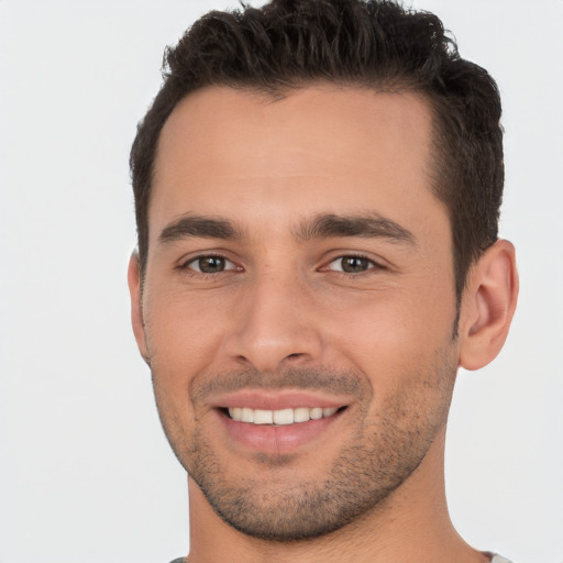 Joyful white young-adult male with short  brown hair and brown eyes