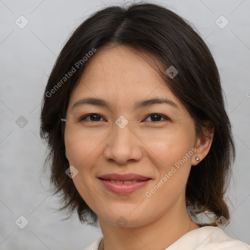 Joyful white adult female with medium  brown hair and brown eyes