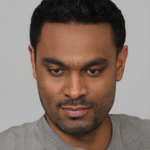 Neutral black young-adult male with short  black hair and brown eyes