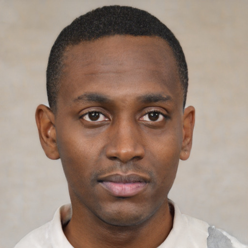 Neutral black young-adult male with short  black hair and brown eyes