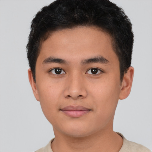 Joyful asian young-adult male with short  brown hair and brown eyes