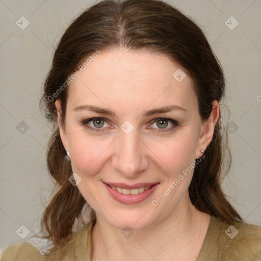 Joyful white young-adult female with medium  brown hair and green eyes