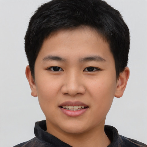 Joyful asian child male with short  black hair and brown eyes