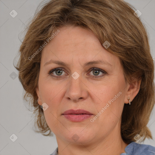 Joyful white adult female with medium  brown hair and grey eyes