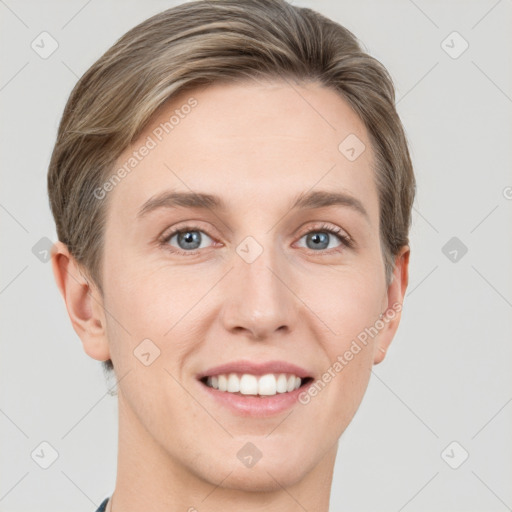 Joyful white young-adult female with short  brown hair and grey eyes