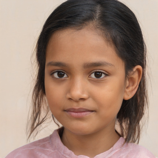 Joyful latino child female with medium  brown hair and brown eyes