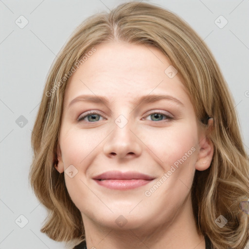 Joyful white young-adult female with long  brown hair and blue eyes