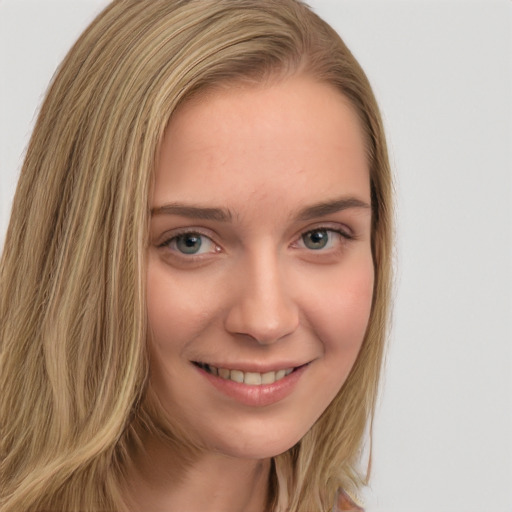 Joyful white young-adult female with long  brown hair and green eyes