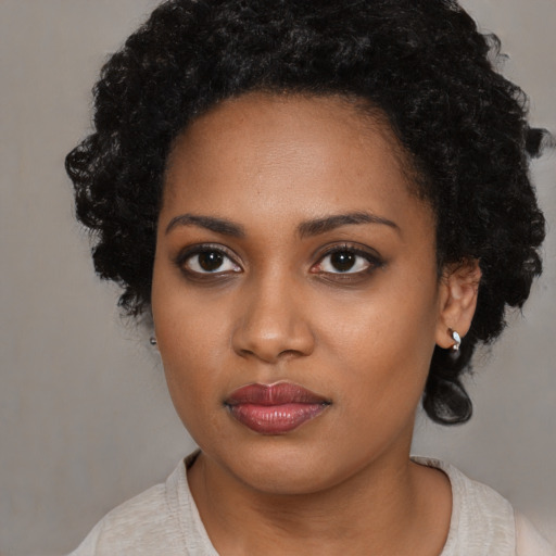 Neutral black young-adult female with medium  black hair and brown eyes