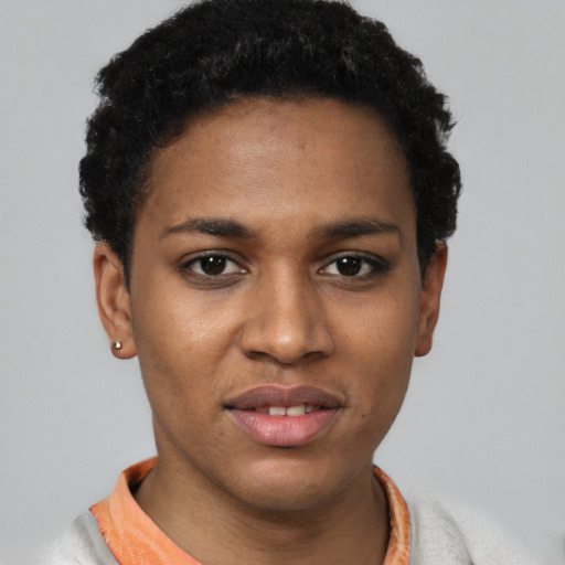 Joyful latino young-adult female with short  black hair and brown eyes