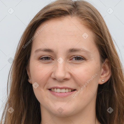 Joyful white young-adult female with long  brown hair and grey eyes