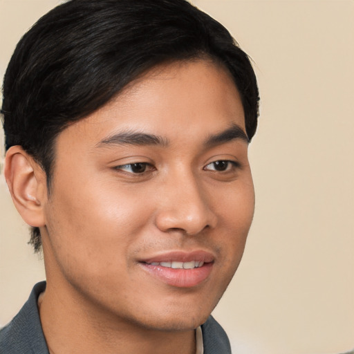 Joyful asian young-adult male with short  brown hair and brown eyes