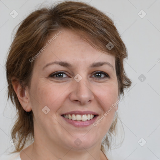 Joyful white adult female with medium  brown hair and brown eyes