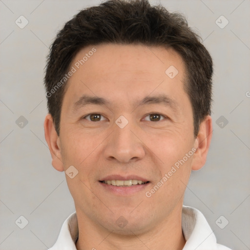 Joyful white adult male with short  brown hair and brown eyes