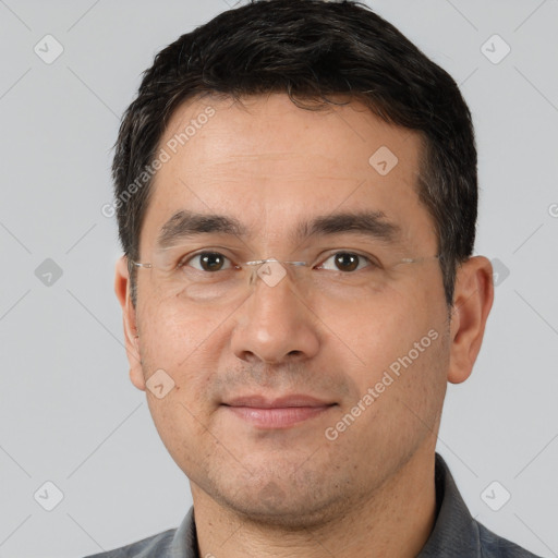 Joyful white adult male with short  brown hair and brown eyes