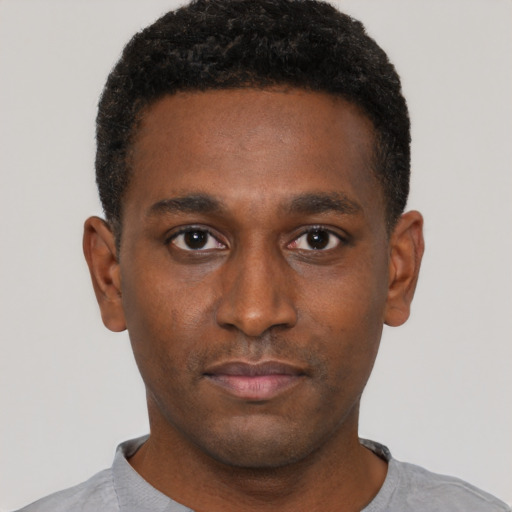 Neutral black young-adult male with short  black hair and brown eyes