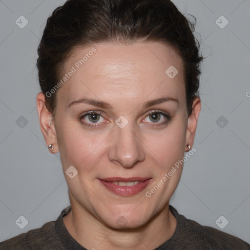 Joyful white adult female with short  brown hair and grey eyes