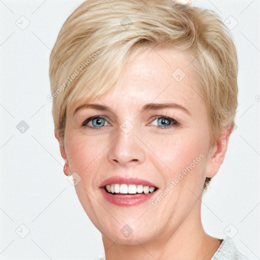 Joyful white adult female with short  brown hair and blue eyes