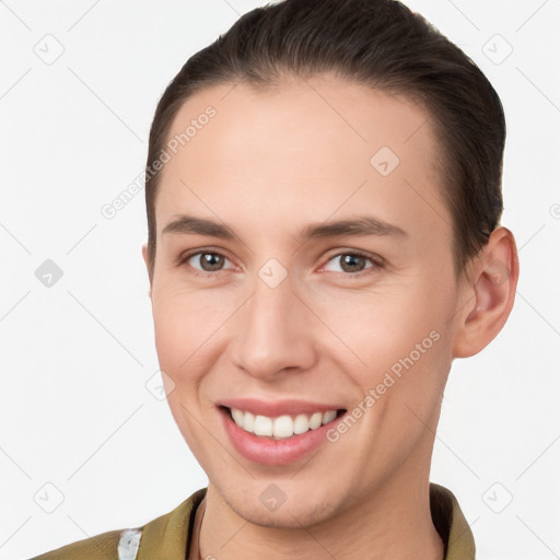 Joyful white young-adult female with short  brown hair and brown eyes