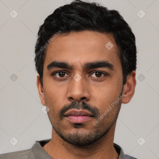 Neutral latino young-adult male with short  black hair and brown eyes