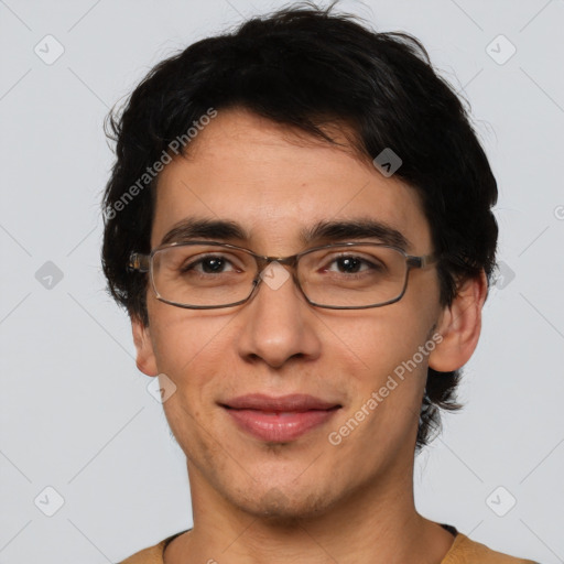 Joyful white adult male with short  black hair and brown eyes