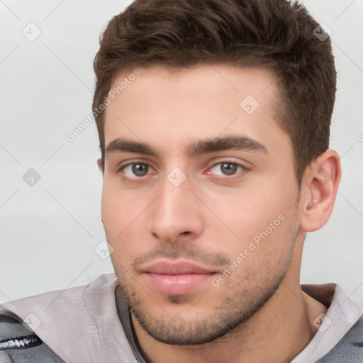 Neutral white young-adult male with short  brown hair and brown eyes