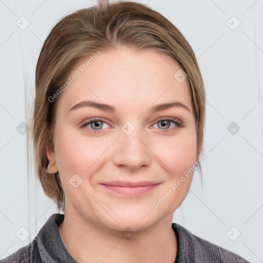 Joyful white young-adult female with medium  brown hair and blue eyes