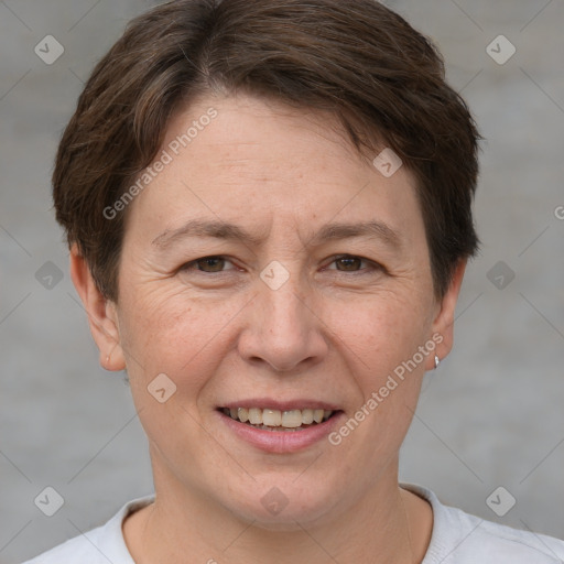 Joyful white adult female with short  brown hair and brown eyes