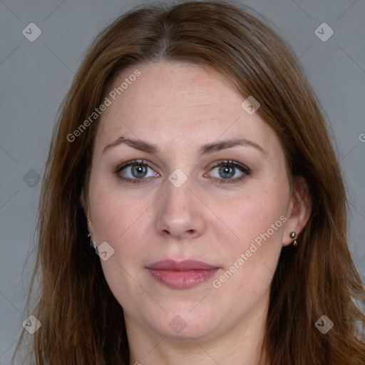 Joyful white adult female with long  brown hair and grey eyes