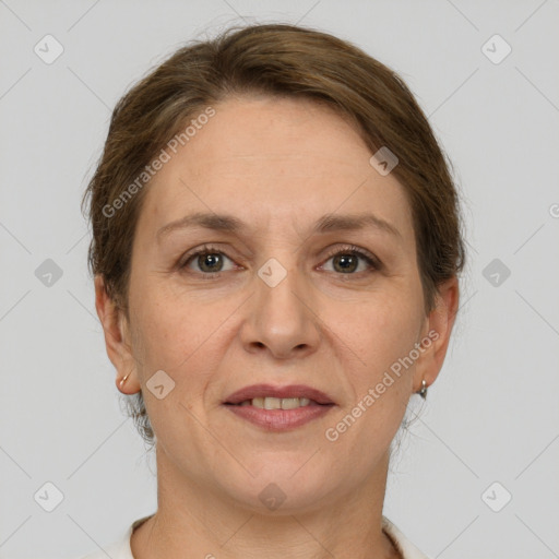 Joyful white adult female with short  brown hair and grey eyes