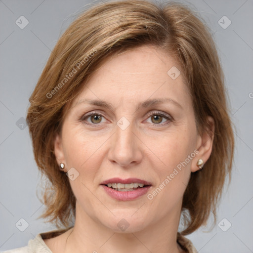 Joyful white adult female with medium  brown hair and grey eyes