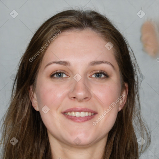 Joyful white young-adult female with long  brown hair and blue eyes