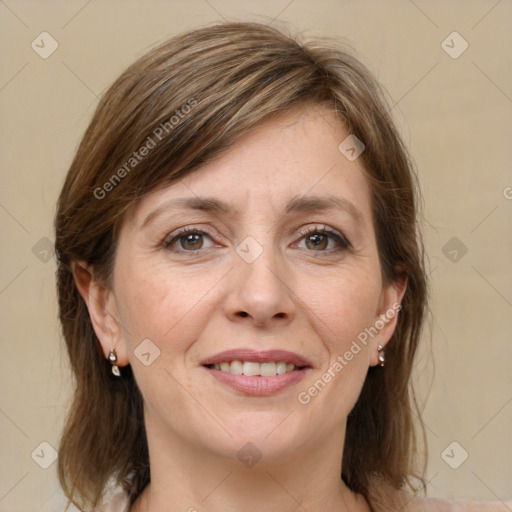 Joyful white adult female with medium  brown hair and grey eyes